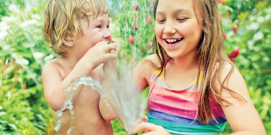 children-enjoying-water-outdoors